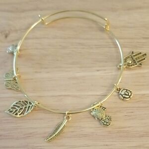 Hand Crafted Gold Charm Bangle Bracelet with Leaf, Feather, Fish & Hamsa Charms